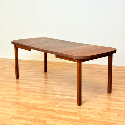 Swedish oval dining table in walnut