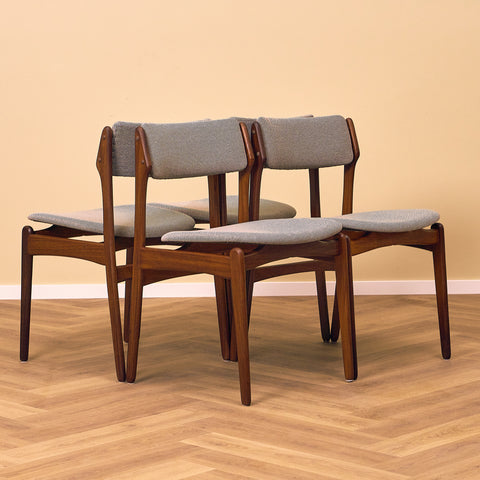 Danish dining chairs in solid walnut by Erik Buch