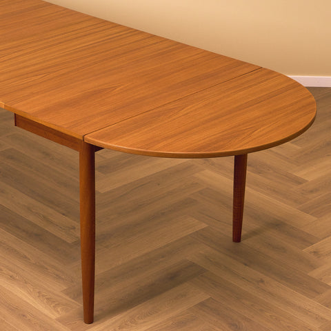 Danish dining table with 4 extensions in teak "Arne Vodder style"