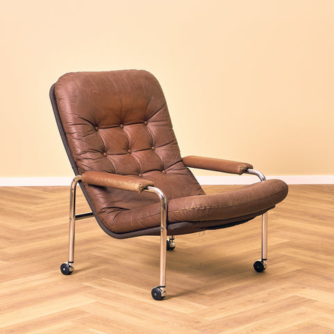Mid-century armchair in leather and chrome