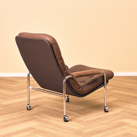 Mid-century armchair in leather and chrome