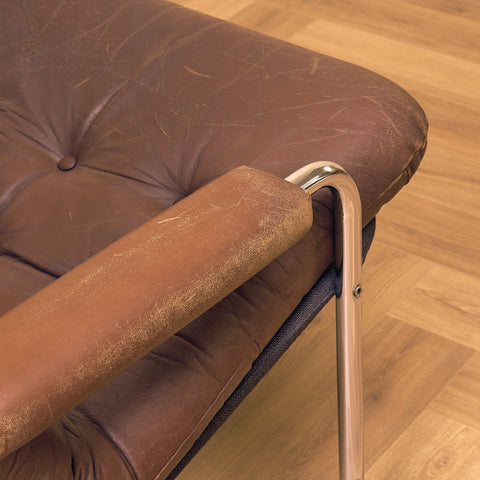Mid-century armchair in leather and chrome