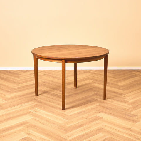 Swedish round dining table in walnut and teak by Ulferts