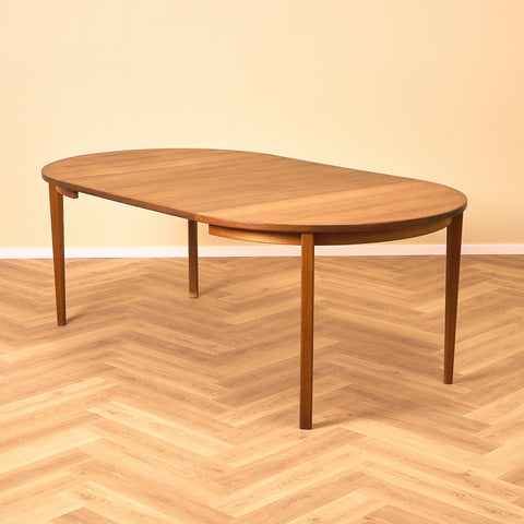 Swedish round dining table in walnut and teak by Ulferts