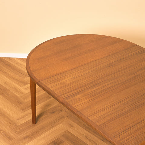 Swedish round dining table in walnut and teak by Ulferts