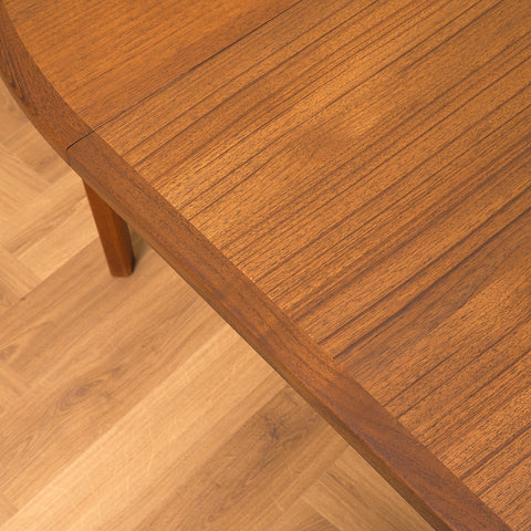 Swedish round dining table in walnut and teak by Ulferts