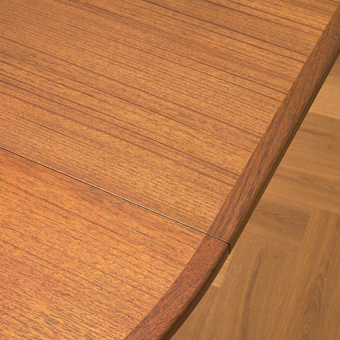 Swedish round dining table in walnut and teak by Ulferts