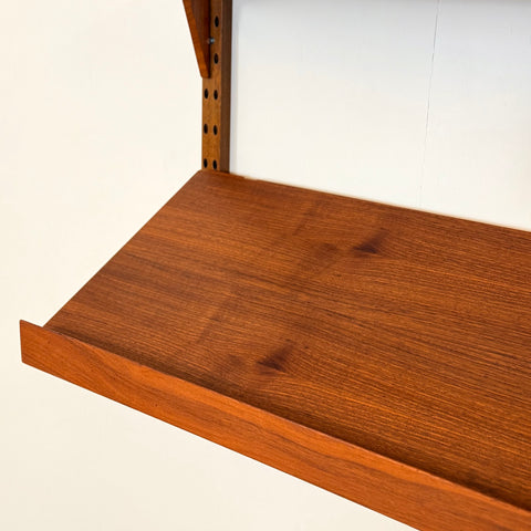 Danish wall unit / shelving system in walnut by Poul Cadovius