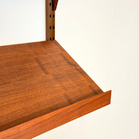 Danish wall unit / shelving system in walnut by Poul Cadovius