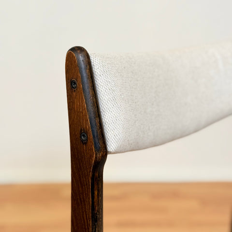 Danish dining chairs in solid stained oak by Erik Buch