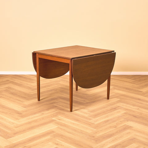 Danish dining table with 4 extensions in teak "Arne Vodder style"