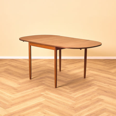 Danish dining table with 4 extensions in teak "Arne Vodder style"