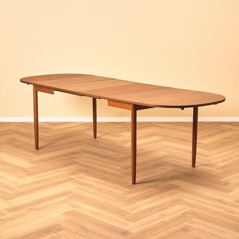 Danish dining table with 4 extensions in teak "Arne Vodder style"