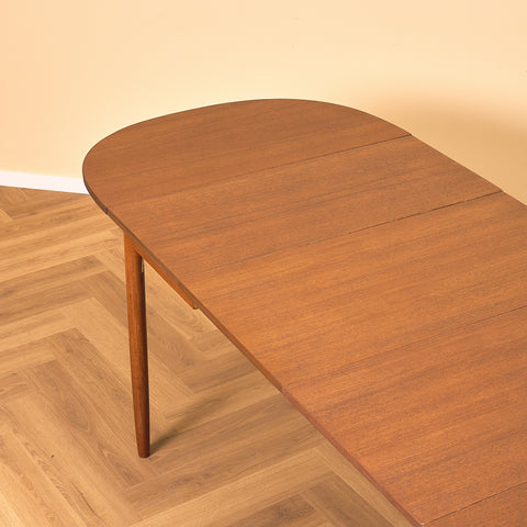 Danish dining table with 4 extensions in teak "Arne Vodder style"
