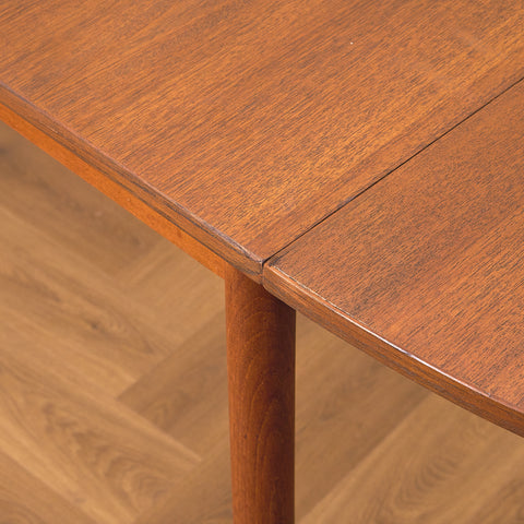 Danish dining table with 4 extensions in teak "Arne Vodder style"