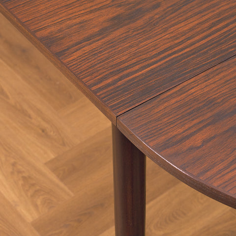 Danish dining table with 4 extensions in Santos rosewood "Arne Vodder style"