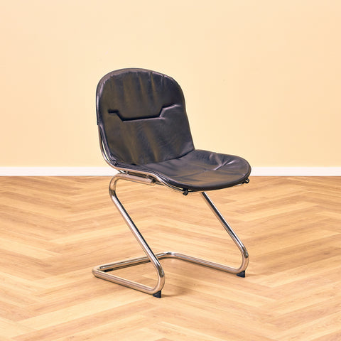 Mid-century dining chairs in chrome and leather