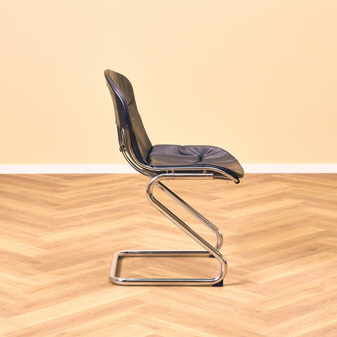 Mid-century dining chairs in chrome and leather