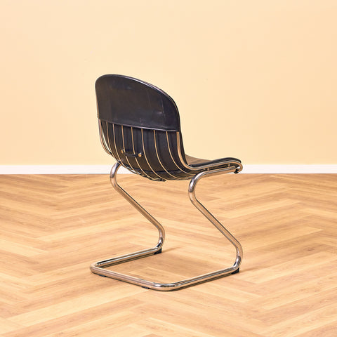 Mid-century dining chairs in chrome and leather