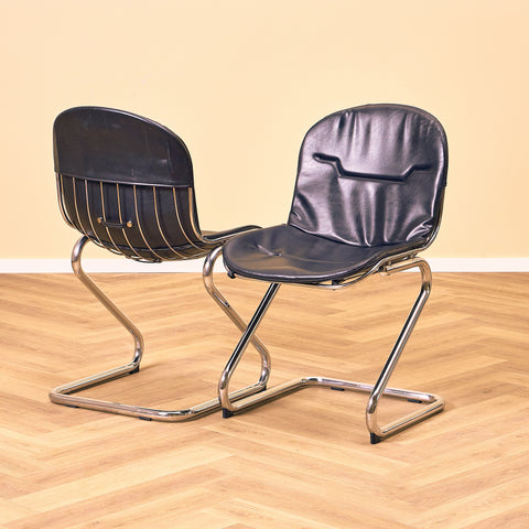 Mid-century dining chairs in chrome and leather