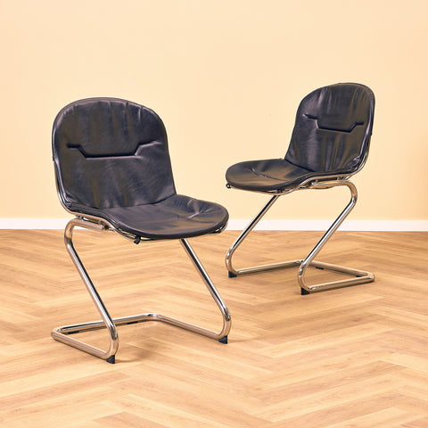 Mid-century dining chairs in chrome and leather