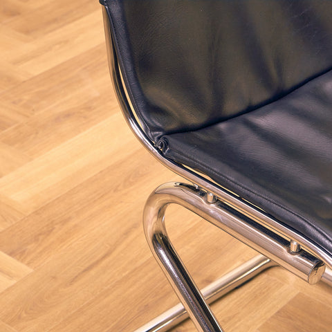Mid-century dining chairs in chrome and leather