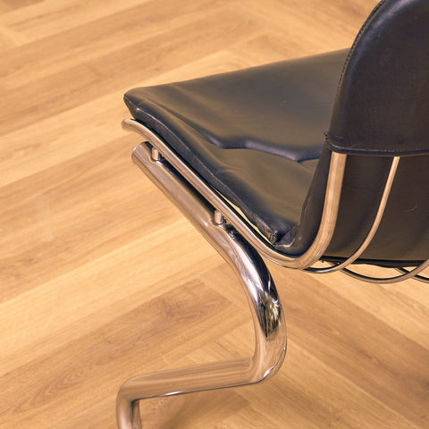 Mid-century dining chairs in chrome and leather