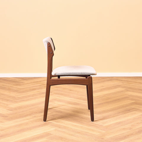 Danish dining chairs in solid walnut by Erik Buch
