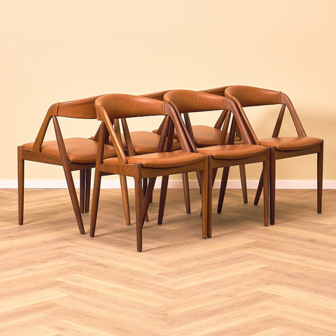 Danish dining chairs in walnut by Kai Kristiansen for Schou Andersen, model 31