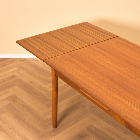 Danish dining table in teak by Arne Vodder