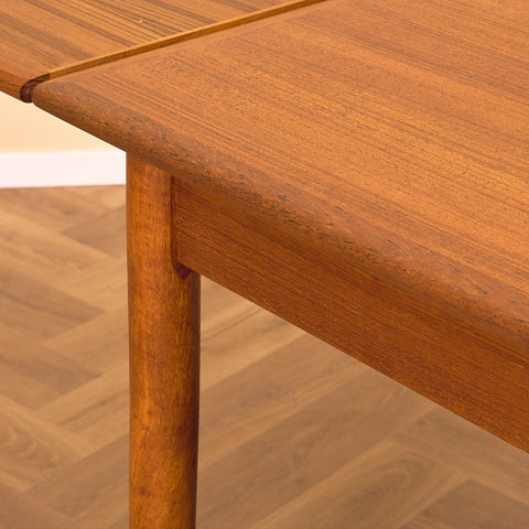 Danish dining table in teak by Arne Vodder