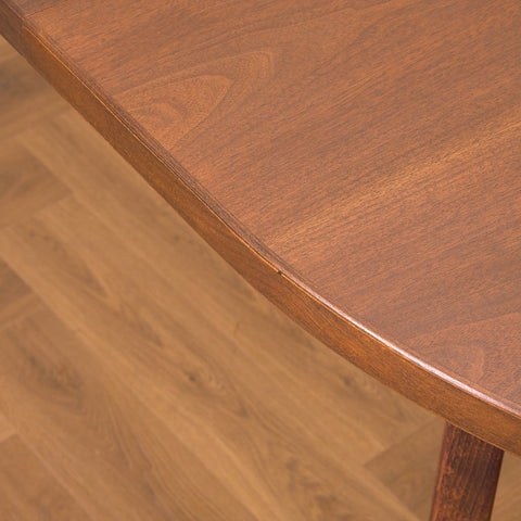 Danish oval dining table in stained teak and beech