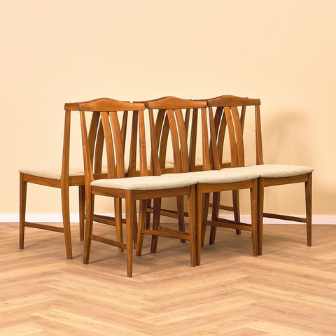Swedish dining chairs in walnut by Karl Erik Ekselius