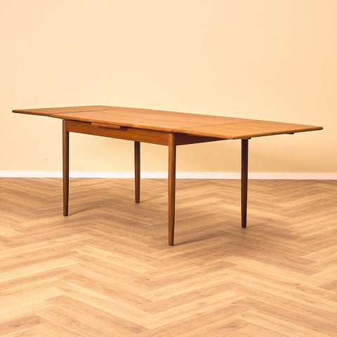 Danish dining table in teak and walnut