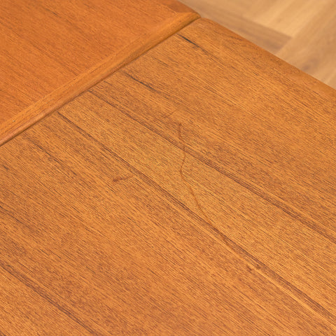 Danish dining table in teak and walnut