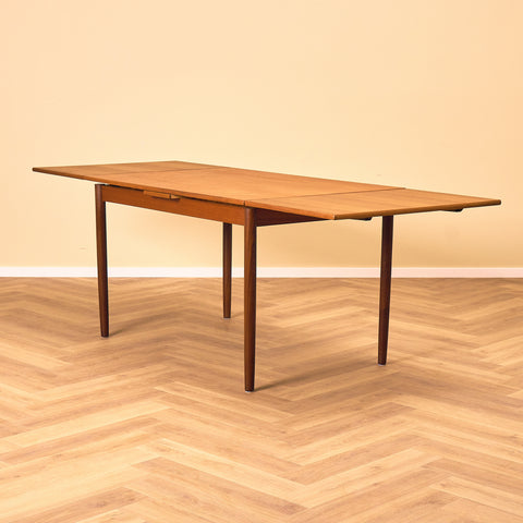 Danish dining table in teak and walnut