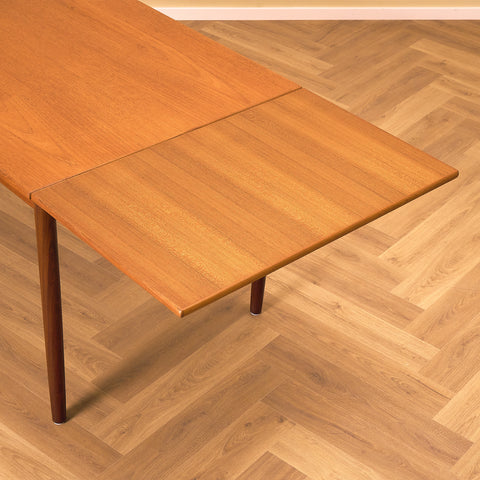 Danish dining table in teak and walnut