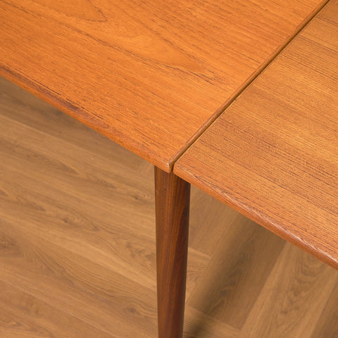 Danish dining table in teak and walnut