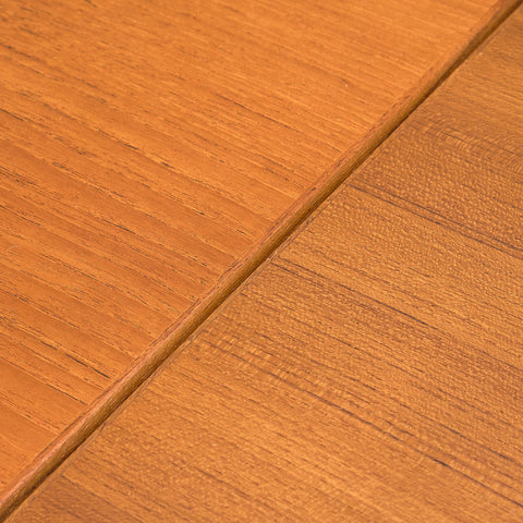 Danish dining table in teak and walnut