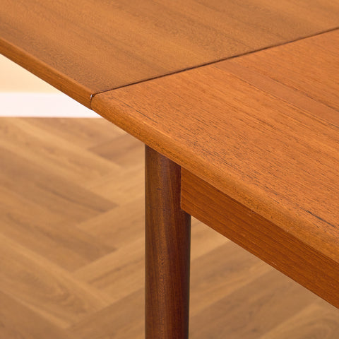 Danish dining table in teak and walnut