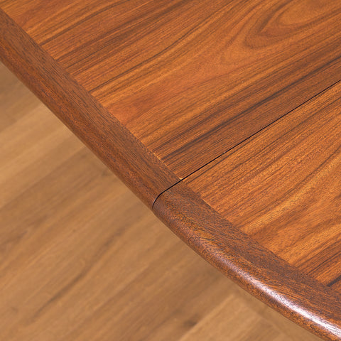 Danish round dining table in walnut & mahogany by Skovby