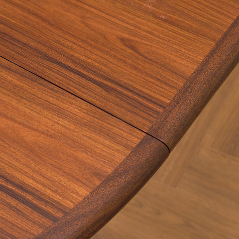 Danish round dining table in walnut & mahogany by Skovby