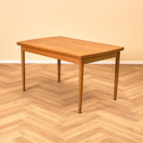 Danish dining table in teak and oak