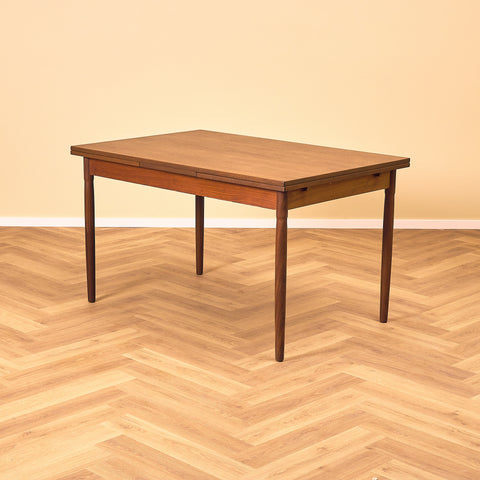 Danish dining table in teak and walnut