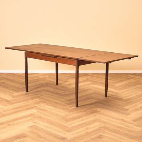 Danish dining table in teak and walnut