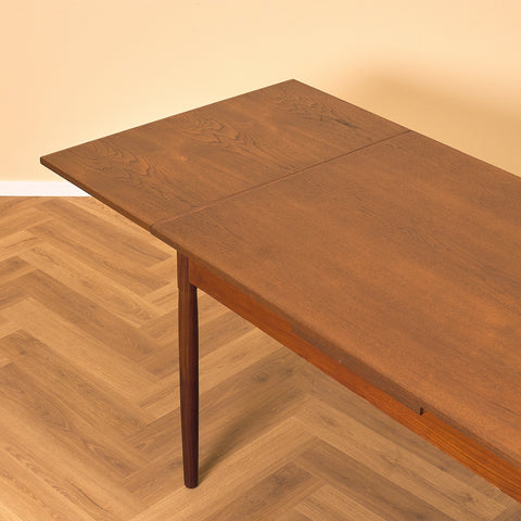 Danish dining table in teak and walnut