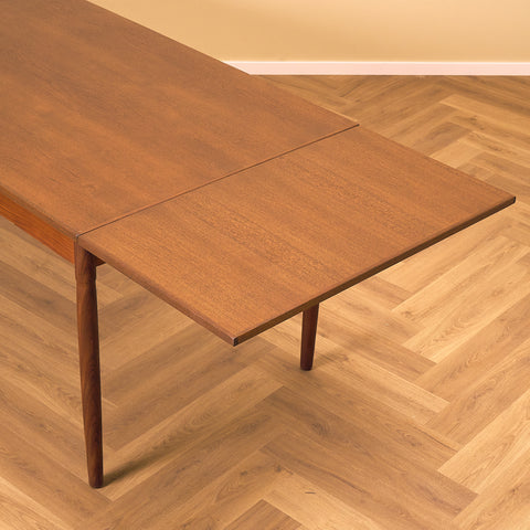 Danish dining table in teak and walnut