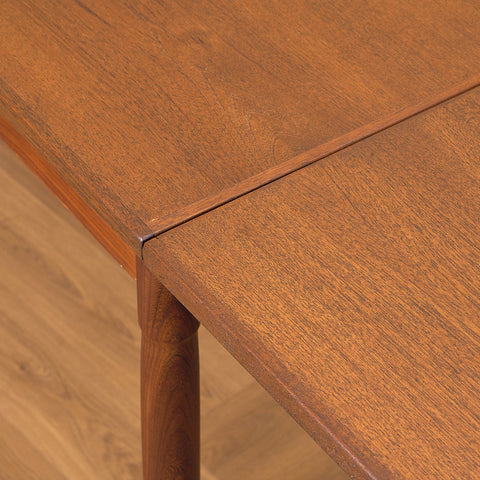 Danish dining table in teak and walnut