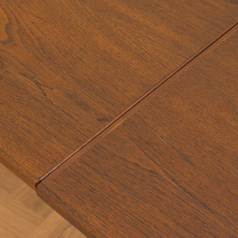 Danish dining table in teak and walnut
