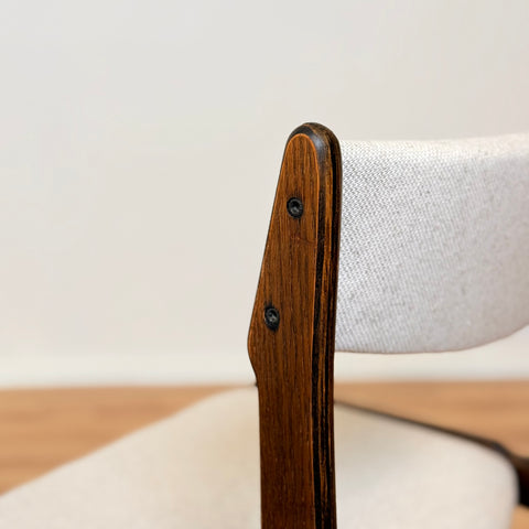 Danish dining chairs in solid stained oak by Erik Buch